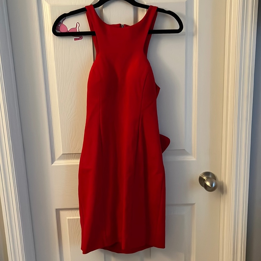 red XSCAPE dress with open back and ruffled bottom